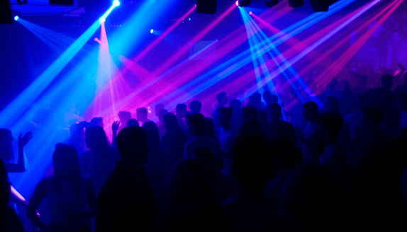 crowded nightclub with colorful lights illustrating the evolving nightlife scene